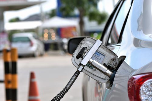 CNG car A CNG car runs exclusively on electricity at low speeds and on fuel at higher speeds. Pure electric, range is limited to no more than five kilometres.